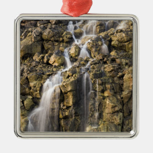 Brine falls from volcanic rock drop off metal tree decoration