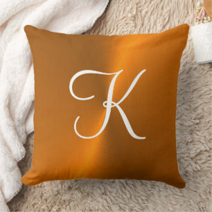 Bronze shiny faux metal monogram cushion