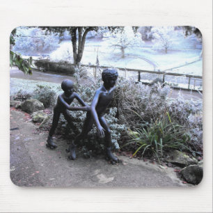 Bronze statue of children skating mouse pad
