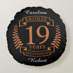 Bronze traditional wedding anniversary 19 years round cushion<br><div class="desc">A design to celebrate 19 years of marriage. This design has a bronze coloured laurel design on a black background. Bronze is the traditional gift for this occasion. The text reads bronze 19 years anniversary. A romantic design to celebrate your 19th year of marriage. If you would like any help...</div>