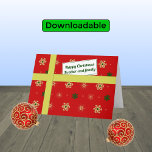 Brother family red christmas parcel holiday card<br><div class="desc">Personal Christmas greetings for your brother and his family. The card has the appearance of a parcel with a colorful pattern of stylized snowflakes in golden and green colors on a red background. The parcel is tied with a golden 'ribbon', and has a 'gift tag' with the message "Happy Christmas...</div>