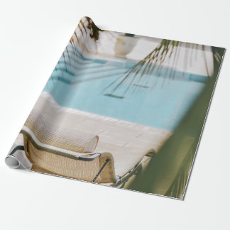 Brown and black armchair beside swimming pool in t wrapping paper