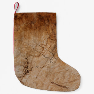 Brown and black wooden surface small christmas stocking