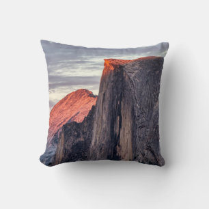 BROWN AND GRAY ROCK FORMATION UNDER GRAY CLOUDS CUSHION
