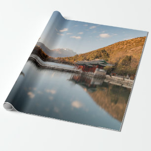 BROWN AND GREEN PAGODA ON BODY OF WATER NEAR MOUNT WRAPPING PAPER