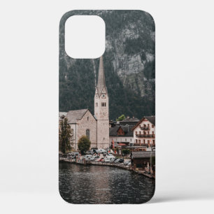 BROWN AND WHITE CONCRETE BUILDING NEAR BODY OF WAT iPhone 12 CASE