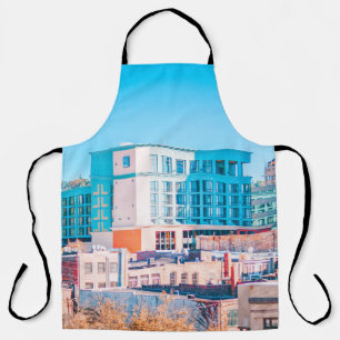 BROWN AND WHITE CONCRETE BUILDING UNDER BLUE SKY APRON
