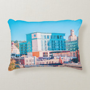 BROWN AND WHITE CONCRETE BUILDING UNDER BLUE SKY DECORATIVE CUSHION