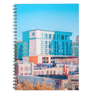 BROWN AND WHITE CONCRETE BUILDING UNDER BLUE SKY NOTEBOOK