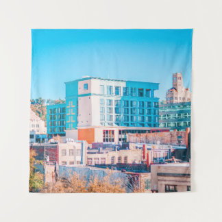 BROWN AND WHITE CONCRETE BUILDING UNDER BLUE SKY TAPESTRY