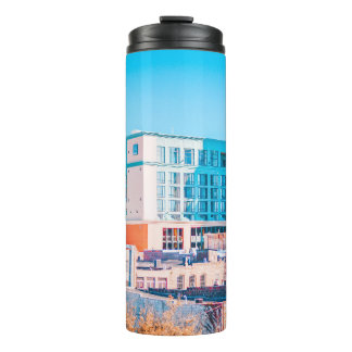 BROWN AND WHITE CONCRETE BUILDING UNDER BLUE SKY THERMAL TUMBLER