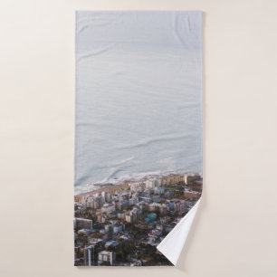 BROWN AND WHITE CONCRETE BUILDINGS BATH TOWEL