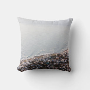 BROWN AND WHITE CONCRETE BUILDINGS CUSHION