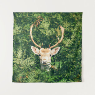 BROWN AND WHITE DEER SURROUNDED BY GREEN PLANTS TAPESTRY