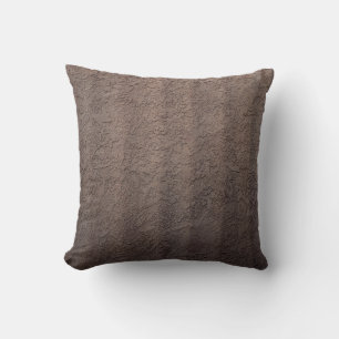 Brown and white floral textile cushion