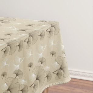Brown and White Ginko Leaves on Tan Tablecloth