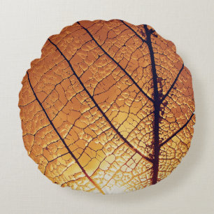 Brown and white leaf print textile round cushion