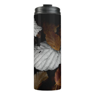 BROWN AND WHITE LEAVES ON GROUND THERMAL TUMBLER