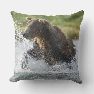 Brown Bear chasing salmon in river Cushion