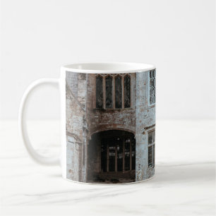 BROWN BRICKED HOUSE NEAR RED FLOWERS COFFEE MUG