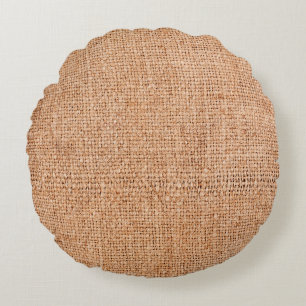 Brown burlap laying on white sheet. Abstract backg Round Cushion