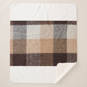 Brown chequered wool plaid fabric texture. tartan sherpa blanket