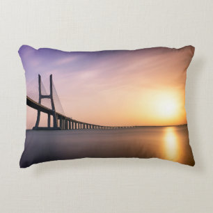 BROWN CONCRETE BRIDGE DURING DAYTIME DECORATIVE CUSHION