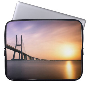 BROWN CONCRETE BRIDGE DURING DAYTIME LAPTOP SLEEVE