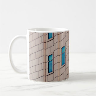 BROWN CONCRETE BUILDING DURING DAYTIME COFFEE MUG