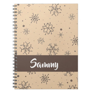 Brown decorative snowflakes on notebook