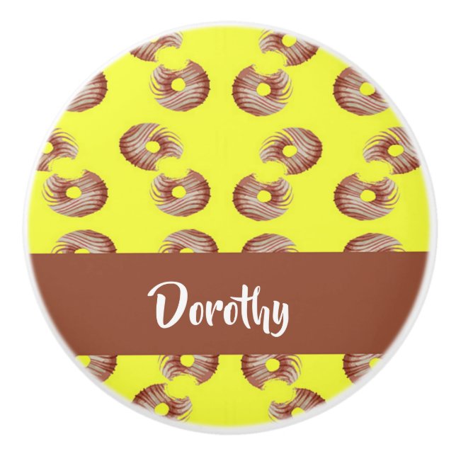 Brown doughnuts on yellow ceramic knob (Front)
