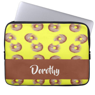 Brown doughnuts on yellow laptop sleeve