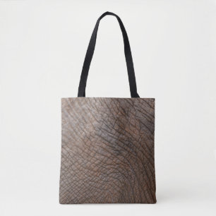 Brown elephant in close up photography tote bag