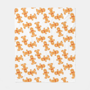 Brown gingerbread man on white fleece blanket