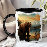 Brown Grizzly Bear Mountain Lake Reflection Mug<br><div class="desc">Enjoy your favourite beverage with the Brown Grizzly Bear Mountain Lake Reflection Mug. This unique mug features a stunning design of a grizzly bear by a tranquil mountain lake, with the majestic scenery beautifully reflected in the water. Customised with your name, it adds a special touch that makes it uniquely...</div>
