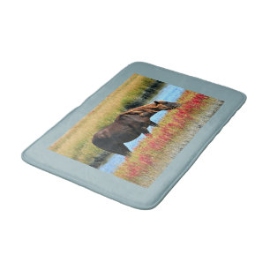 Brown Horse Grazing with Blue Water Border Bath Mat