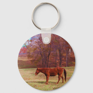 Brown horse in a grass field key ring