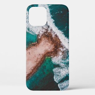 BROWN ISLAND SURROUNDED BY SEA WATER DURING DAYTIM iPhone 12 CASE
