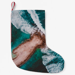 BROWN ISLAND SURROUNDED BY SEA WATER DURING DAYTIM SMALL CHRISTMAS STOCKING