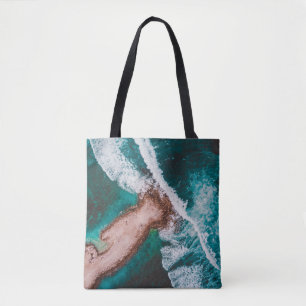 BROWN ISLAND SURROUNDED BY SEA WATER DURING DAYTIM TOTE BAG
