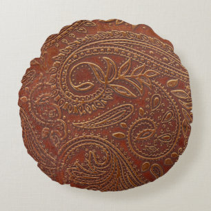 Brown leather, tooled floral pattern. round cushion
