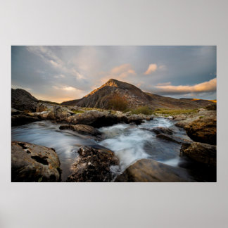 BROWN MOUNTAIN NEAR BODY OF WATER UNDER CLOUDY SKY POSTER