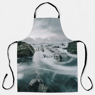 BROWN ROCK AND CLIFF SURROUNDED BODY OF WATER APRON