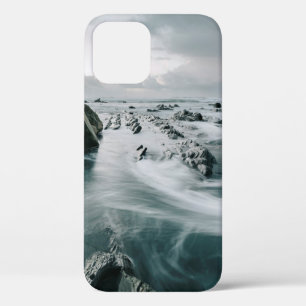 BROWN ROCK AND CLIFF SURROUNDED BODY OF WATER iPhone 12 CASE