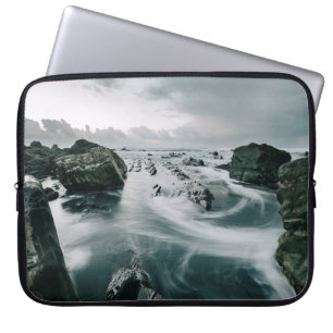 BROWN ROCK AND CLIFF SURROUNDED BODY OF WATER LAPTOP SLEEVE