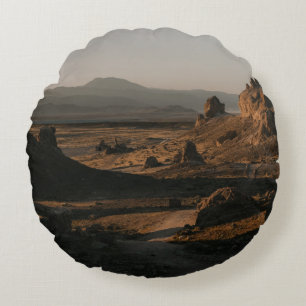 BROWN ROCK FORMATION ON BROWN FIELD DURING DAYTIME ROUND CUSHION