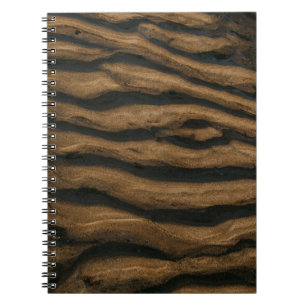 Brown sand with footprints during daytime notebook