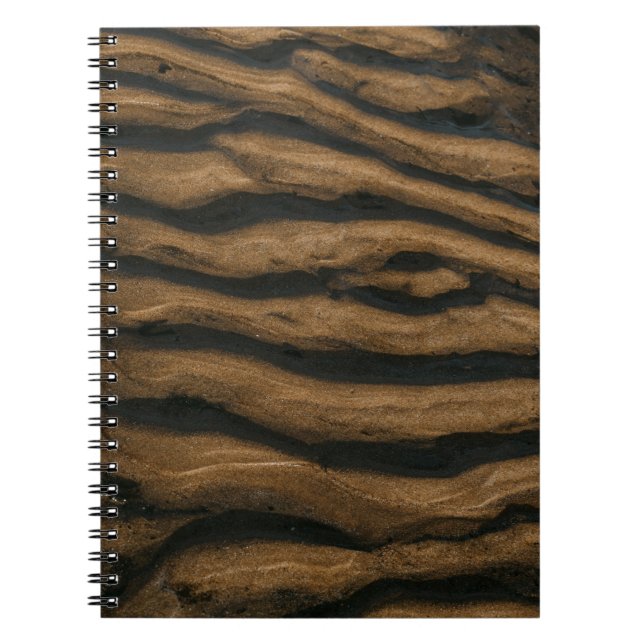 Brown sand with footprints during daytime notebook (Front)
