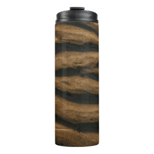 Brown sand with footprints during daytime thermal tumbler