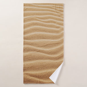 BROWN SAND WITH SHADOW OF PERSON BATH TOWEL